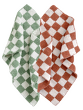 Green and rust checkered towels layered on a white background. Soft, textured fabric design.