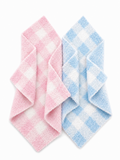 Pink and blue checkered washcloths stacked in a diagonal arrangement against a white background.