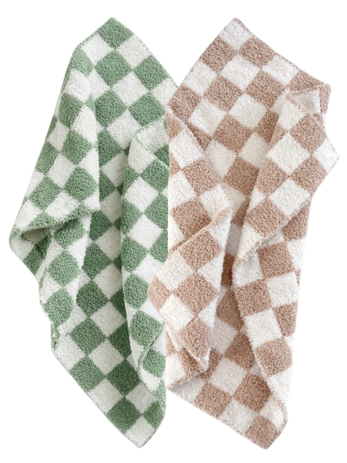Two textured checkered towels in green and white, and brown and white, stacked neatly.