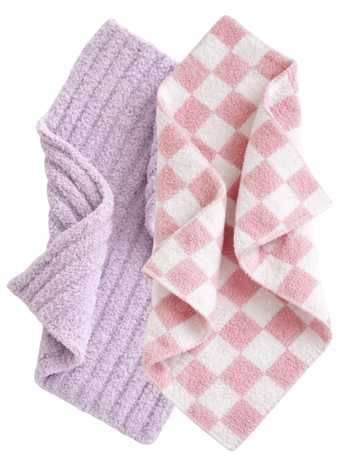 Two soft towels: one purple textured and one pink and white checkered. Ideal for kitchen or bathroom use.