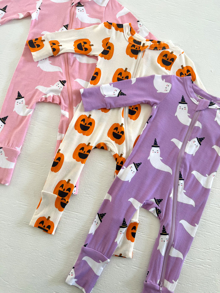 Three colorful toddler onesies featuring ghosts and pumpkins, perfect for Halloween festivities.