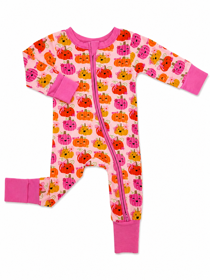 Pink toddler onesie patterned with colorful pumpkins and a front zipper. Ideal for fall or Halloween outfits.