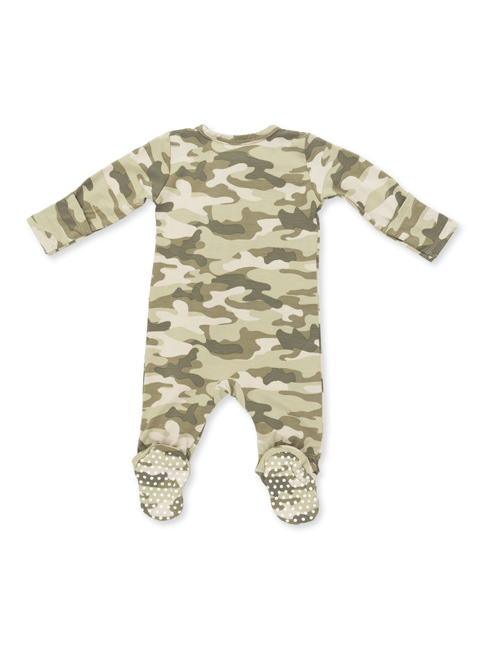Back view of a camouflage-patterned baby onesie with grip soles on the feet.