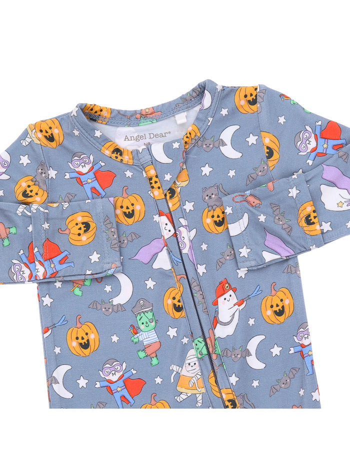 Children's pajama with fun Halloween characters: pumpkins, ghosts, and bats on a blue background.