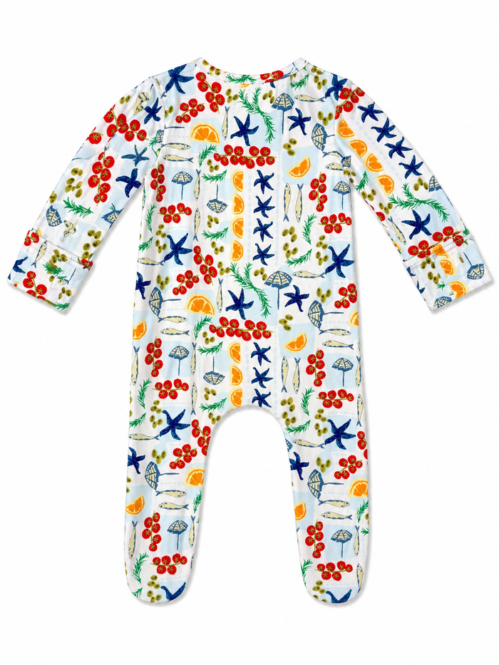 Colorful children's pajama suit with fruit, fish, and starfish patterns on a white background.