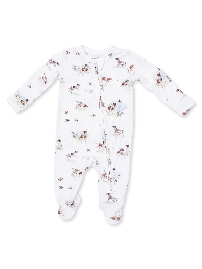 White baby onesie with dog and bird prints, featuring long sleeves and zipper closure. Perfect for comfort and style.
