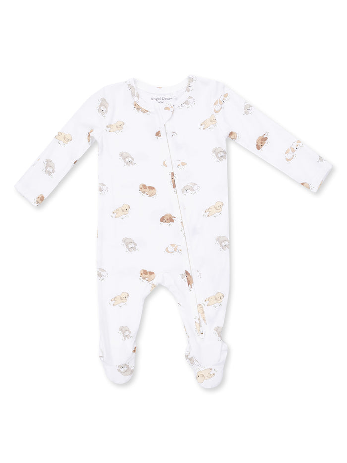 White baby onesie with long sleeves and a zipper, featuring a playful print of puppies.