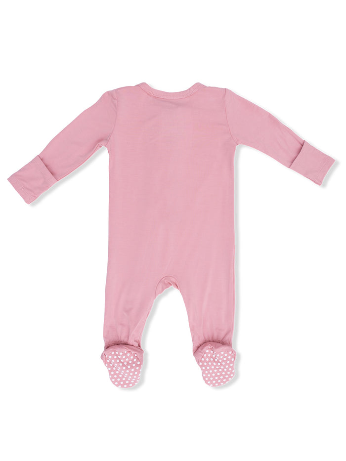 Pink baby onesie with long sleeves and polka dot feet, shown from the back.
