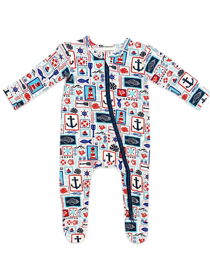 Baby zip-up romper featuring nautical patterns like anchors, lighthouses, and sea creatures in vibrant colors.