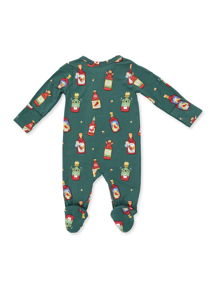 Green baby onesie featuring colorful cartoon condiment bottles in a playful pattern.