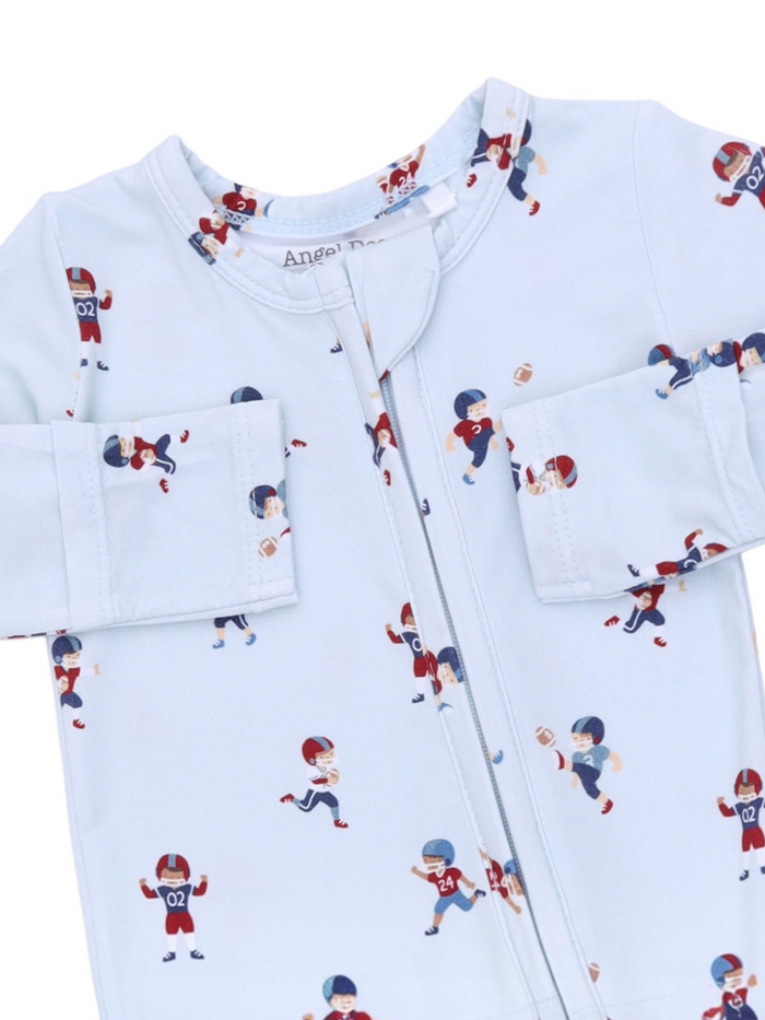 Light blue pajamas featuring playful football player patterns in various poses. Perfect for young sports fans.