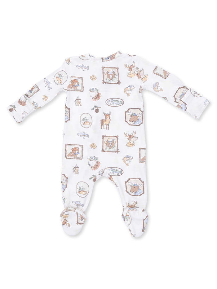 Baby onesie featuring whimsical nature-themed patterns, including animals and framed illustrations.