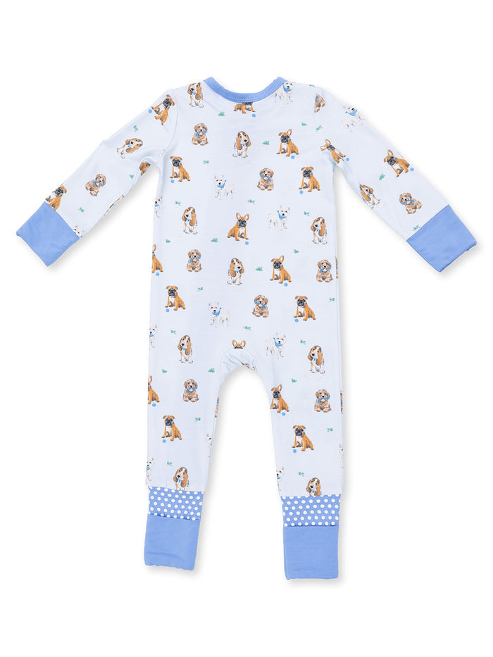 Child's footed pajamas with dog prints, featuring long sleeves and cuffed blue details. Ideal for cozy sleepwear.