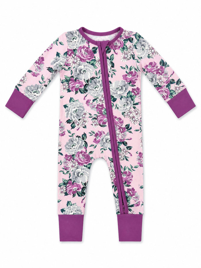 Floral baby onesie in pink with purple accents and zipper front, featuring roses and leaves design.