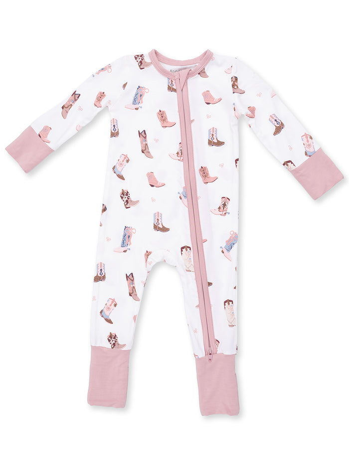 White onesie pajama with pink accents, featuring a playful cowboy boot pattern and a front zipper.