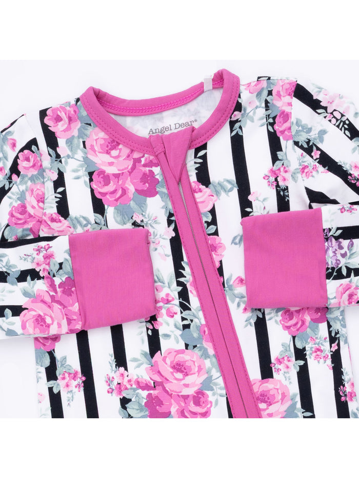 Pink floral print infant romper with black and white stripes, featuring long sleeves and a zip closure.