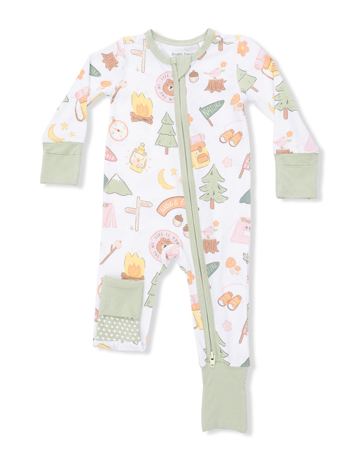 Children's zip-up pajamas with camping-themed prints, including trees, campfires, and nature icons.