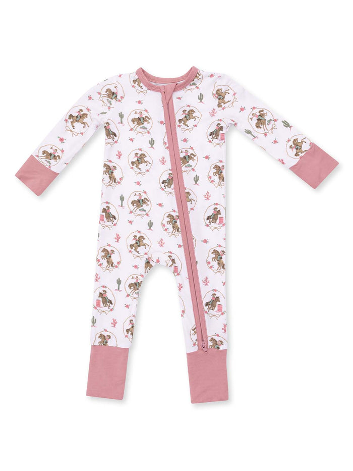 Children's zip-up onesie featuring playful illustrations, pink accents, and floral designs on a white background.