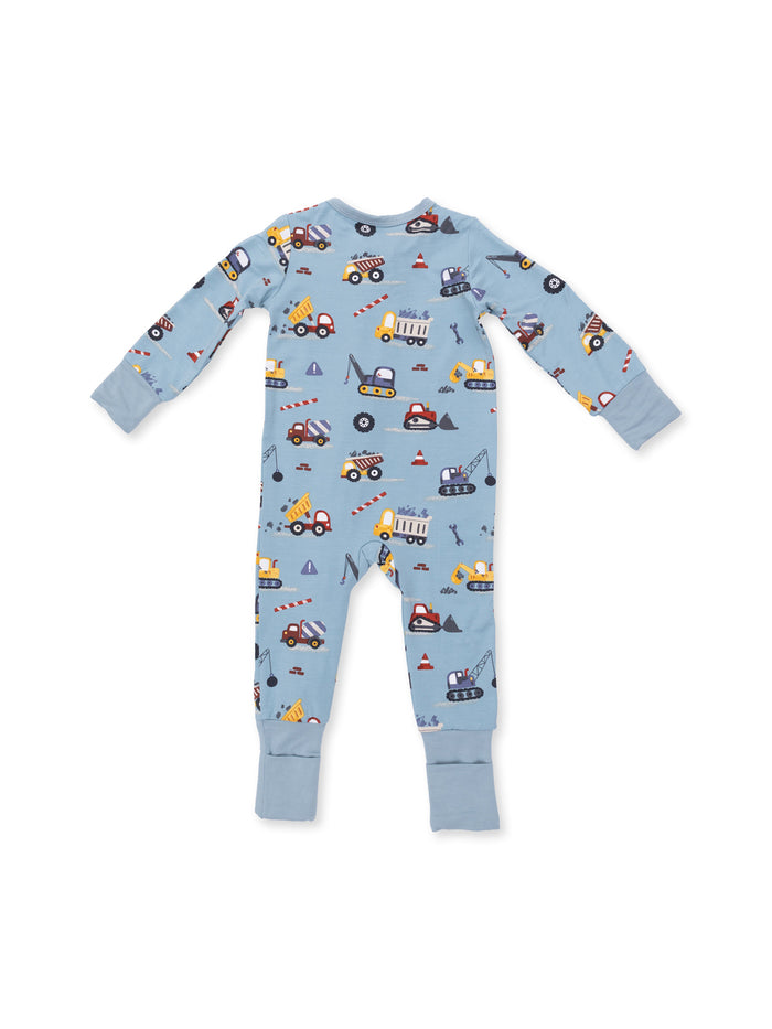 Blue toddler pajamas featuring colorful construction vehicle patterns. Soft and cozy for bedtime.