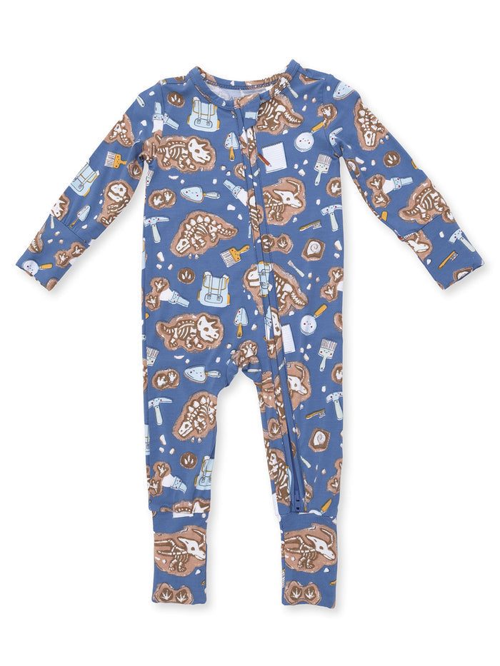 Blue baby onesie with playful prints of animal fossils and tools, featuring long sleeves and a front snap closure.