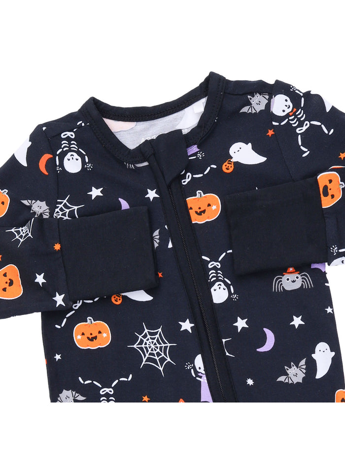 Halloween-themed baby onesie with ghosts, pumpkins, and spider designs on a dark background.