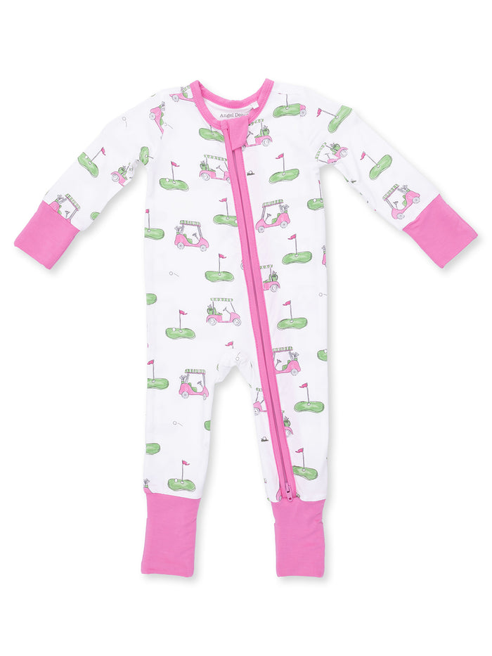 Child's golf-themed pajama romper with pink accents and zipper, featuring golf carts and flags on a white background.