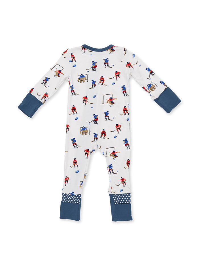 Back view of a children's pajama set featuring a playful hockey print on a white background.