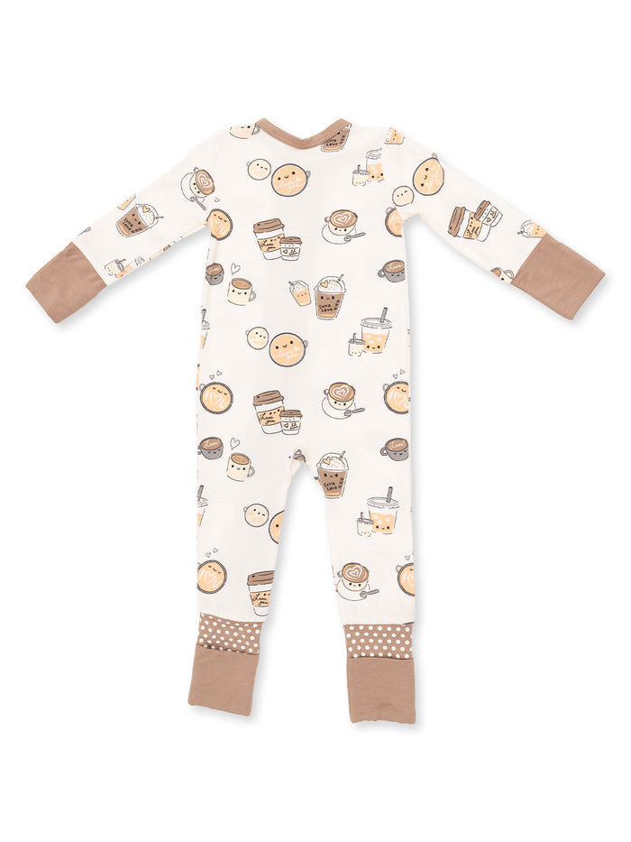 Children's pajamas with cute drink-themed patterns in soft colors and brown cuffs. Ideal for cozy sleepwear.