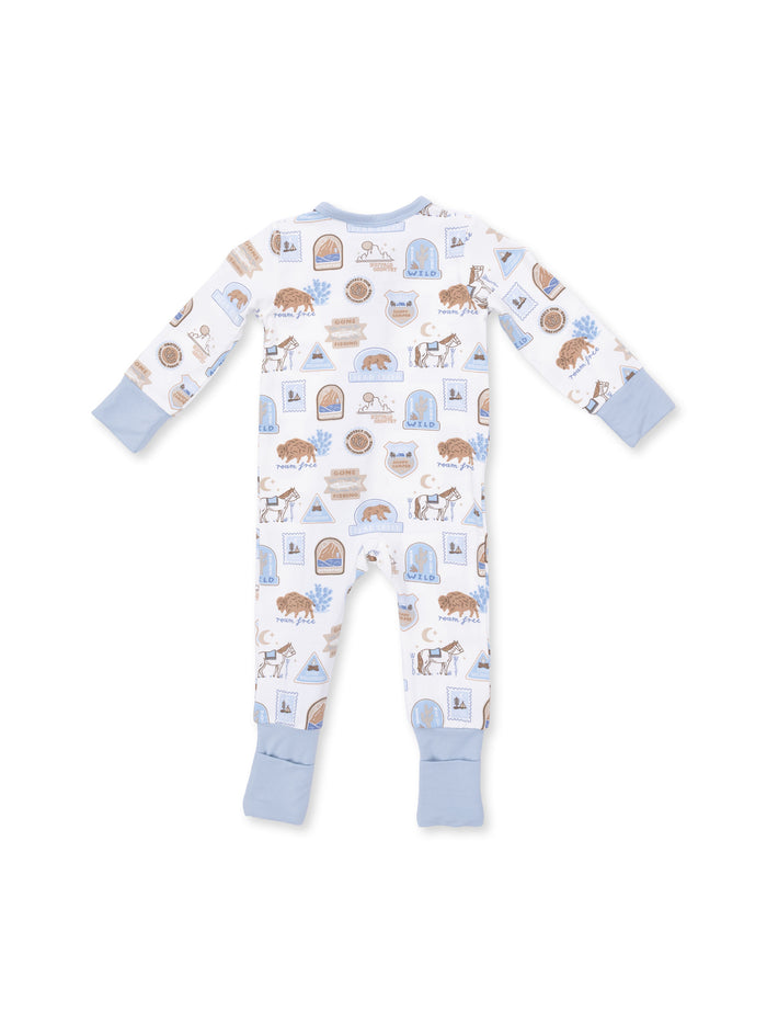 Light blue pajama onesie with animal and nature patterns, featuring long sleeves and footed design.