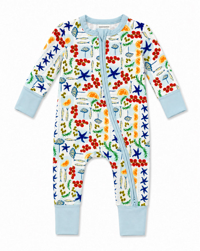 Colorful infant onesie with a playful nature-themed print, featuring starfish, umbrellas, and fruits.