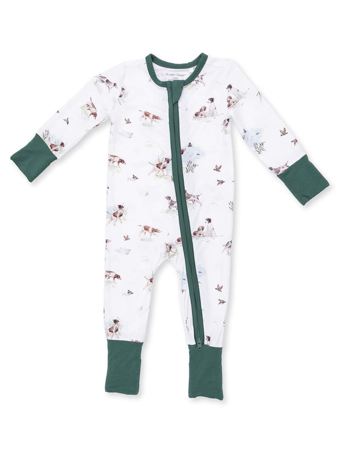 White onesie with green accents, featuring a whimsical animal print of dogs and birds, zippered front design.