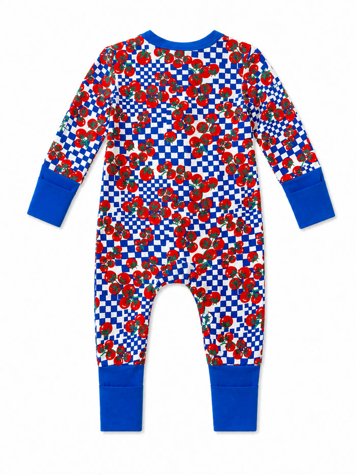 Red tomato-patterned onesie with blue cuffs on a white background, viewed from the back.