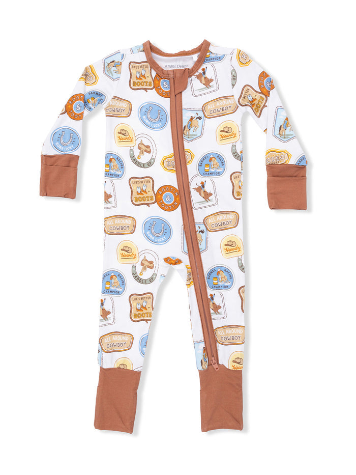 Toddler cowboy-themed pajamas with colorful patches and a front zipper. Perfect for playful sleepwear.