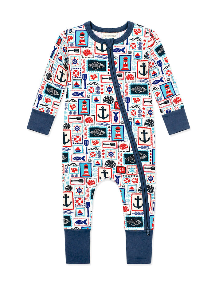 Nautical-themed baby onesie with anchor, lighthouse, and sea creature patterns in vibrant colors.