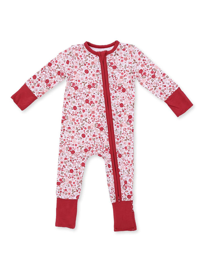 Floral-patterned baby onesie with red accents and a front zipper, designed for comfort and style.