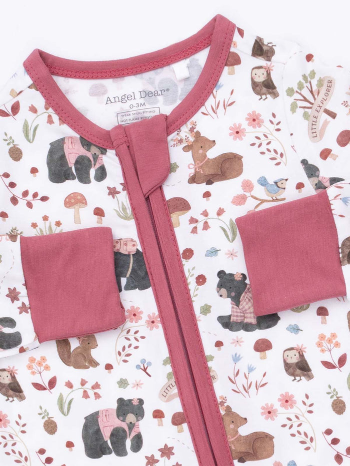 Baby onesie featuring playful animals and floral patterns, zip closure, and soft pink accents. Ideal for infants.