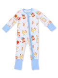 Infant onesie with colorful prints of bananas, teddy bears, and food items, featuring a front zipper and blue cuffs.