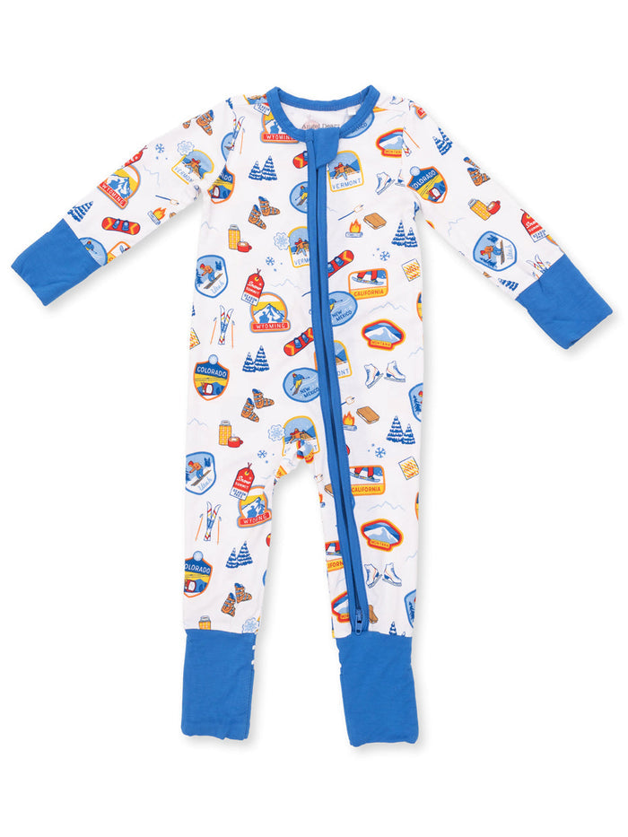 Colorful children's pajama onesie featuring playful travel-themed graphics and blue accents.