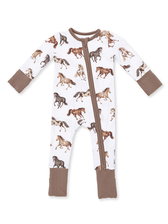 White children's pajamas featuring a playful horse print and brown cuffs. Ideal for cozy sleepwear.