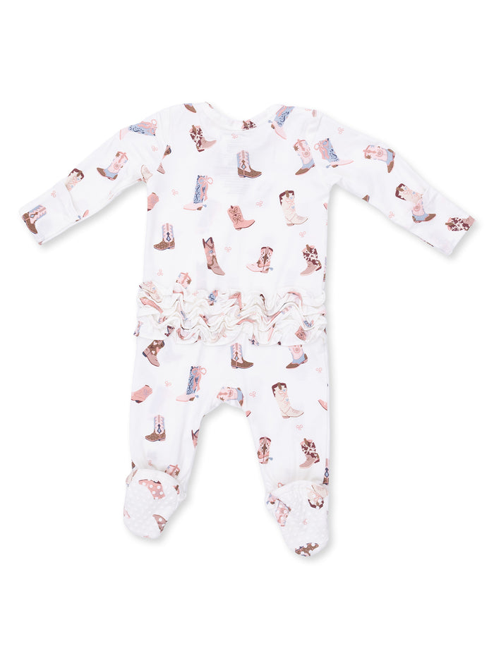 White baby onesie with a cowboy boot pattern and ruffled waist, featuring long sleeves and footed design.
