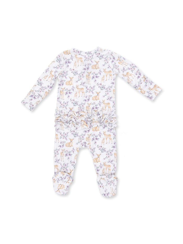 White baby onesie with deer and floral patterns, featuring long sleeves and ruffled detailing at the back.