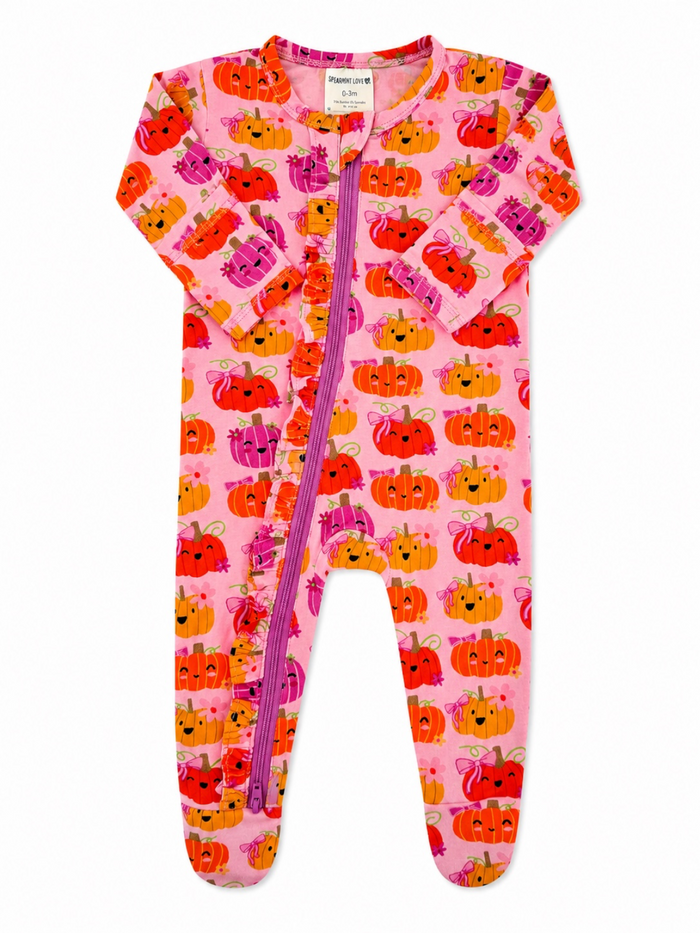 Pink infant onesie with pumpkin patterns and a front zipper, designed for comfort and style. Perfect for fall.