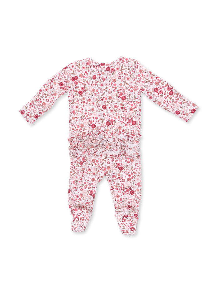 Floral patterned onesie with long sleeves and ruffled detailing at the waist. Ideal for infants and toddlers.