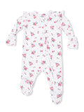 White floral baby onesie with pink roses and ruffles, featuring a front zipper and footed design.