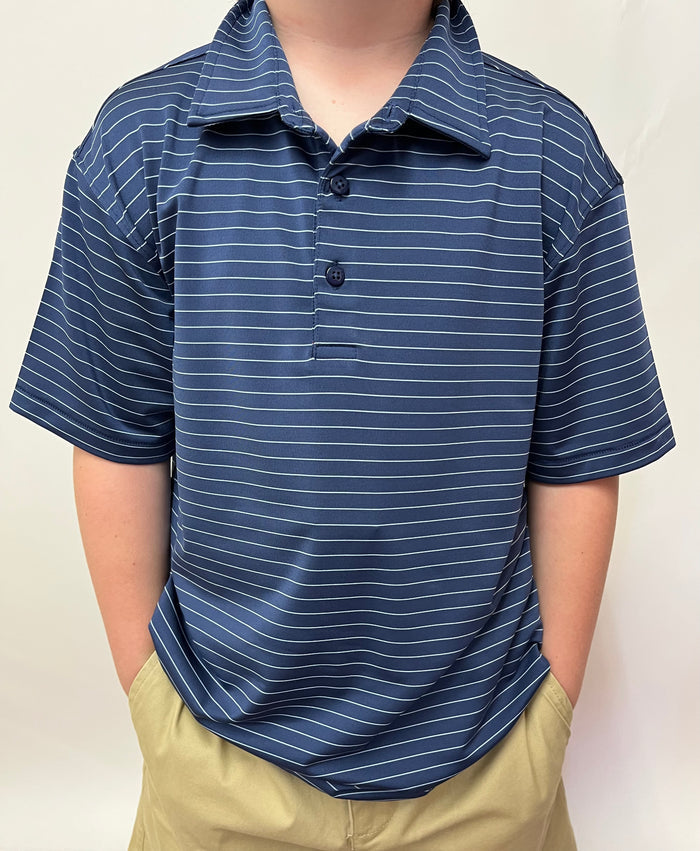 Person wearing a blue striped polo shirt and beige pants against a plain background