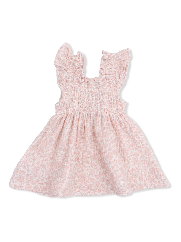 Light pink floral dress with ruffled sleeves and a smocked bodice. Perfect for summer occasions.