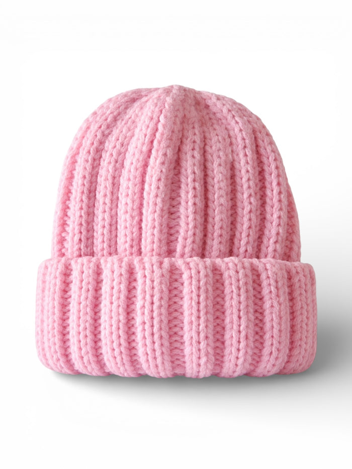 Pink knitted beanie hat with a ribbed texture, folded brim, and a soft appearance.