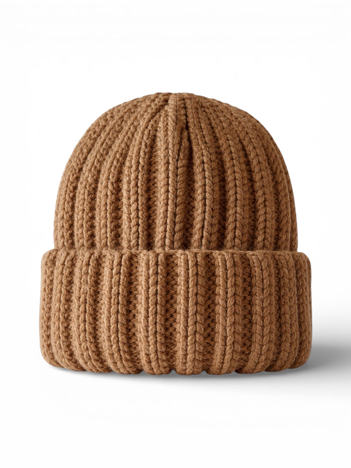 Knitted brown beanie with a ribbed texture placed against a light background.