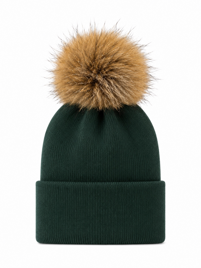 Green knitted beanie with a large brown pom-pom on top, suitable for cold weather.