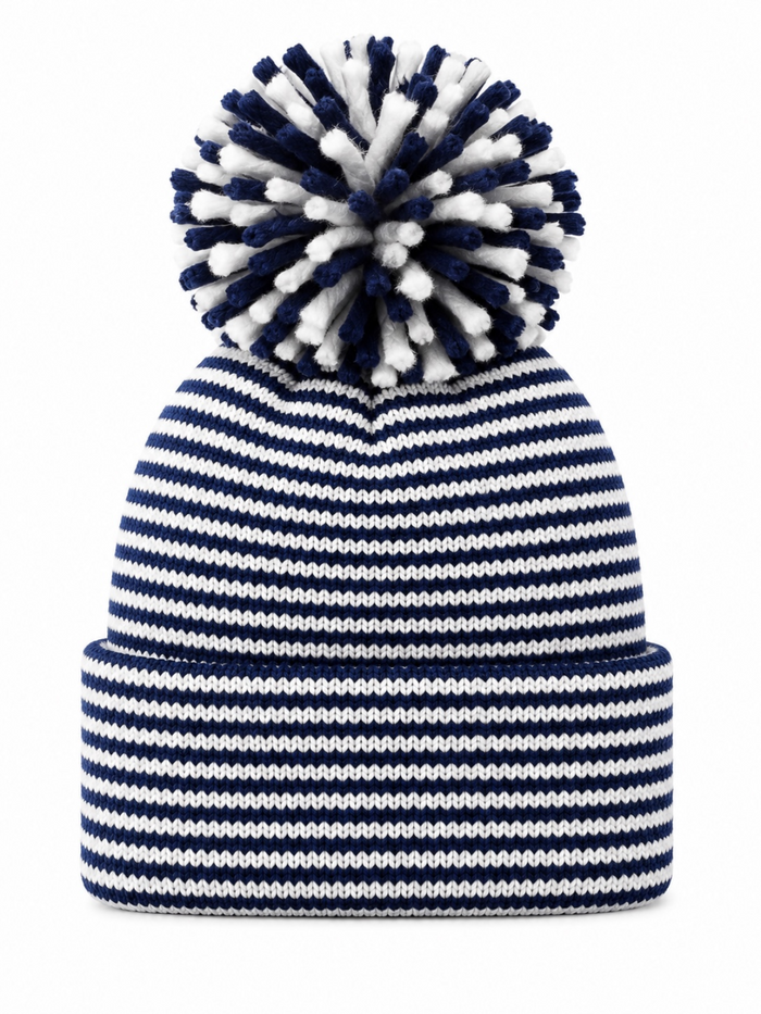 Navy and white striped beanie with a fluffy pom-pom on top.